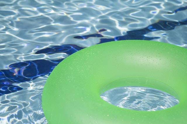 Green pool float in Clear Pool Water