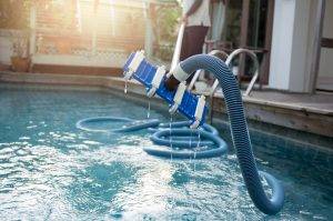 Pool Vacuum cleaning mustard algae out of a pool