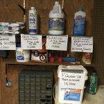 multiple pool chemicals on a shelf