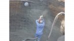 close-up of gunite being shot into wall in deep end.jpg