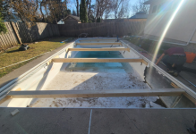 A pool being built in a backyardAI-generated content may be incorrect.