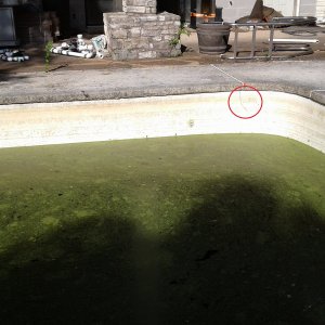 Water level at pool pad floor deep end house side - crack.jpg