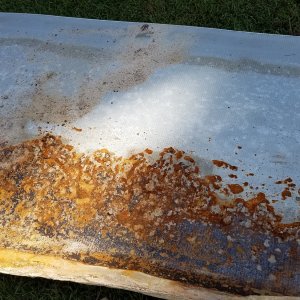 rust on bottom of pool wall.jpg