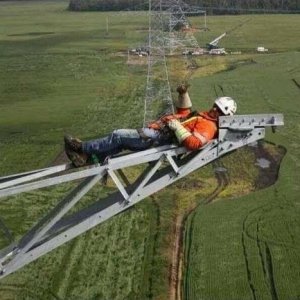 Guy on transmission tower.jpg