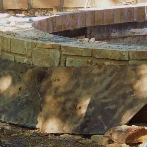 sandstone wall with Oklahoma flagstone for cap and showing tile -- still dusty hard to tell co...jpg