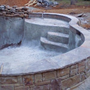sandstone wall with Oklahoma flagstone for cap and showing tile.jpg