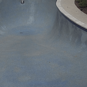 Drained pool showing discoloration.png