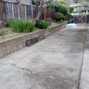 Entire side of house is concrete - no place to trench.jpg