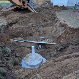 SHOWS PIPES AROUND DRYWELL FROM GUTTER POOL AND BROKEN PIPE.jpg