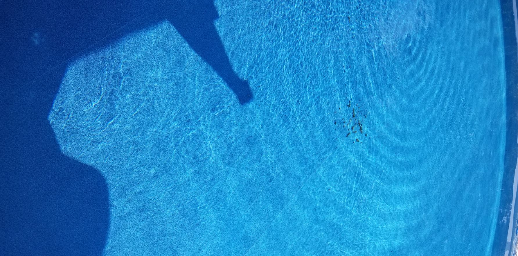 clear pool water 7.5.2020 with gunk in center.JPG