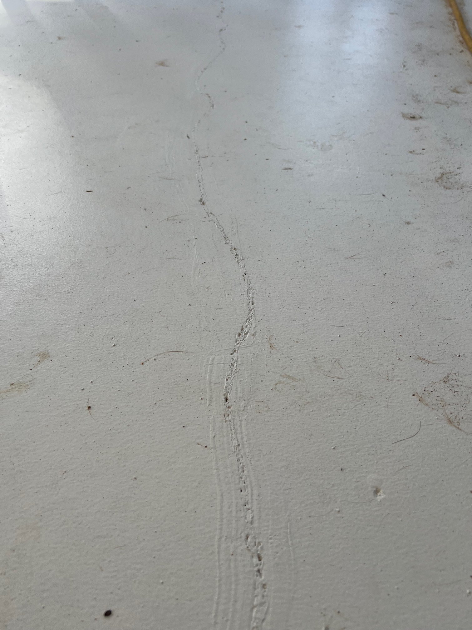 Concrete crack looks worst after they patched it