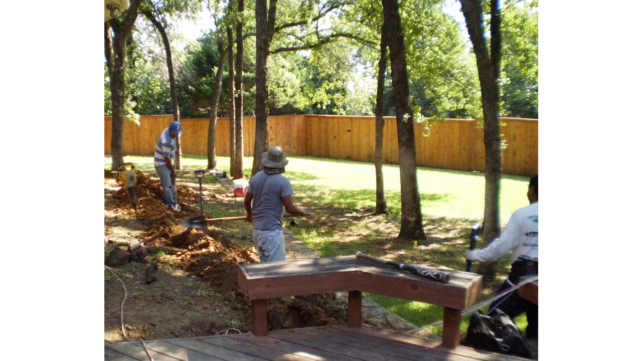 electricians running new circuit underground from other side of house.jpg