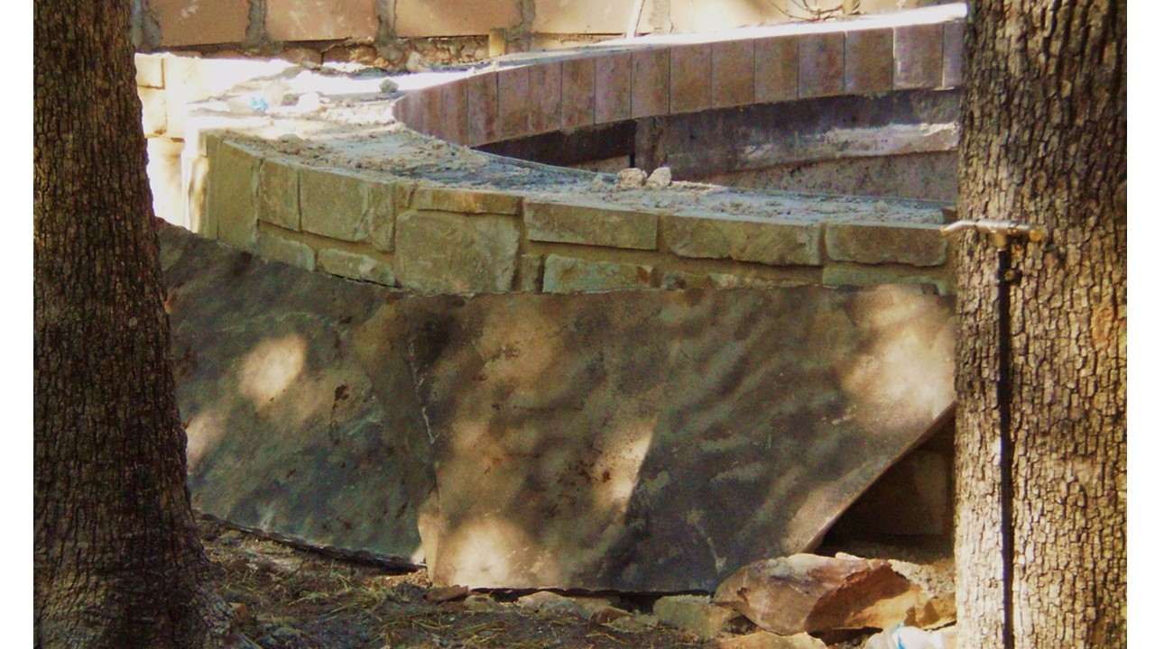 sandstone wall with Oklahoma flagstone for cap and showing tile -- still dusty hard to tell co...jpg